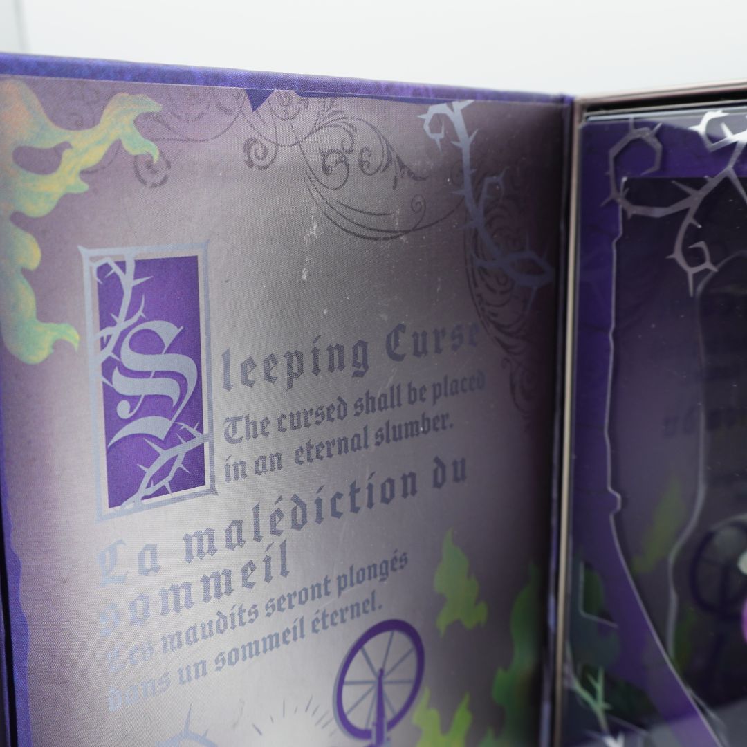 Decorative book cover with text and symbols, featuring a prominent 'S' on a purple background.