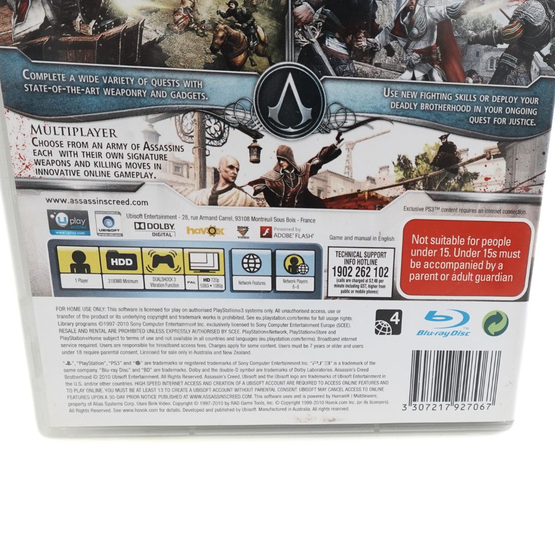 Barcode, branding and copyright information seen at the bottom of the back of the 2010 PS3 Assassins Creed Brotherhood game