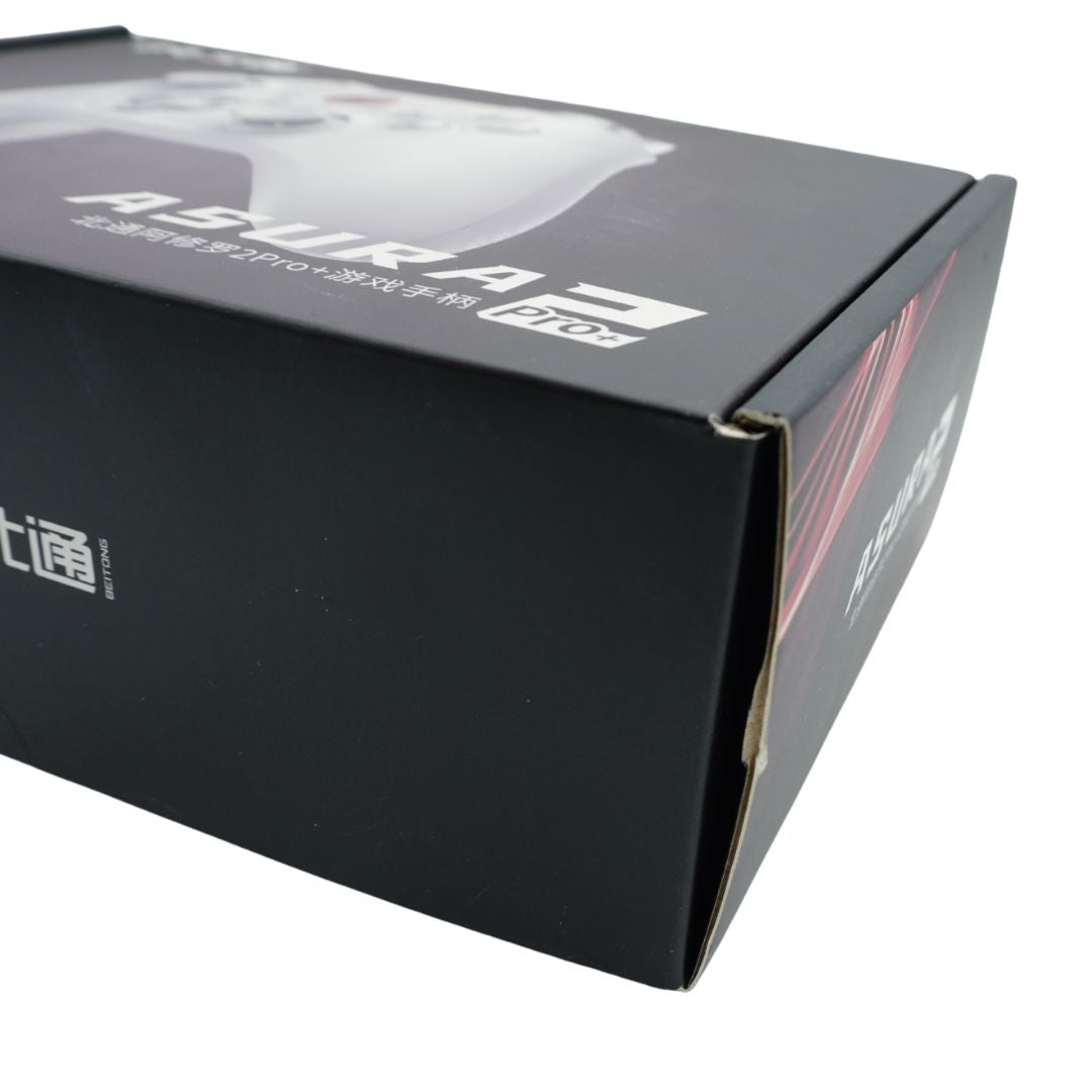 A black cardboard box holding an Asura 2 Pro+ controller in a white colour