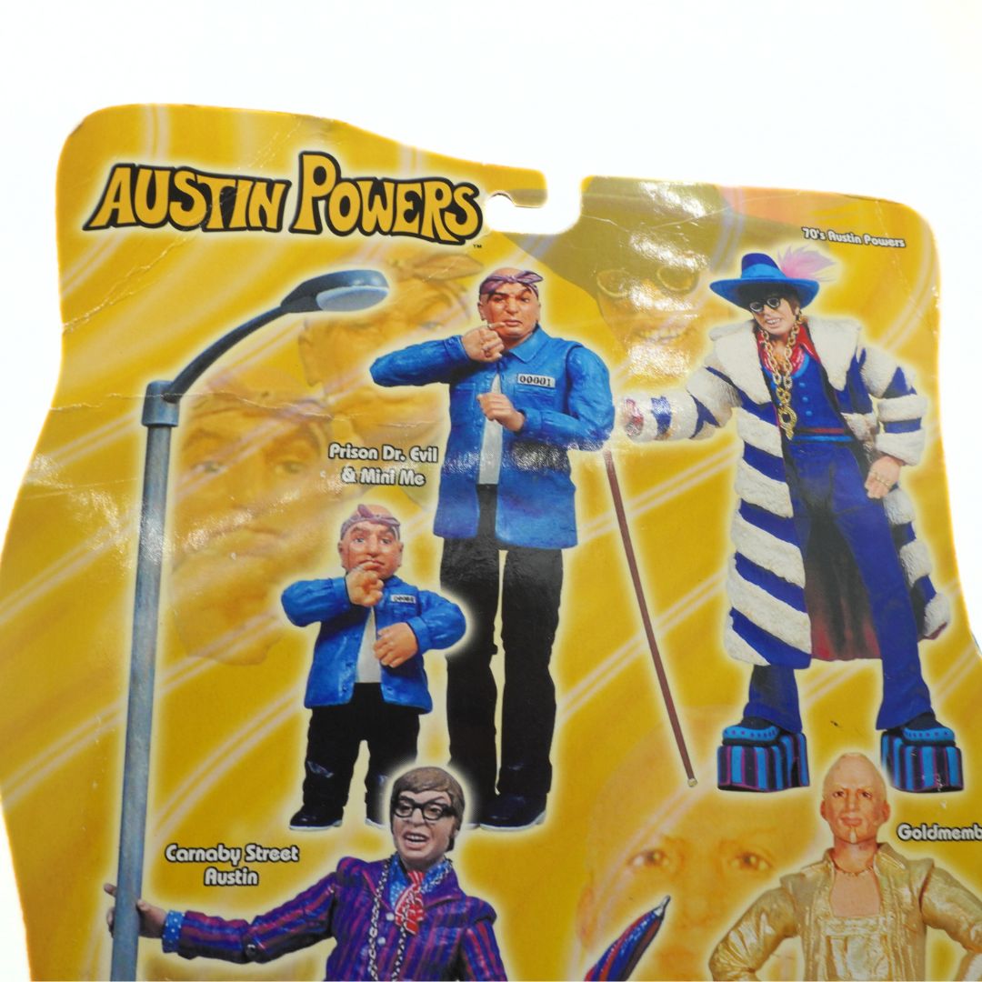 Austin Powers action figure packaging with characters and a yellow background