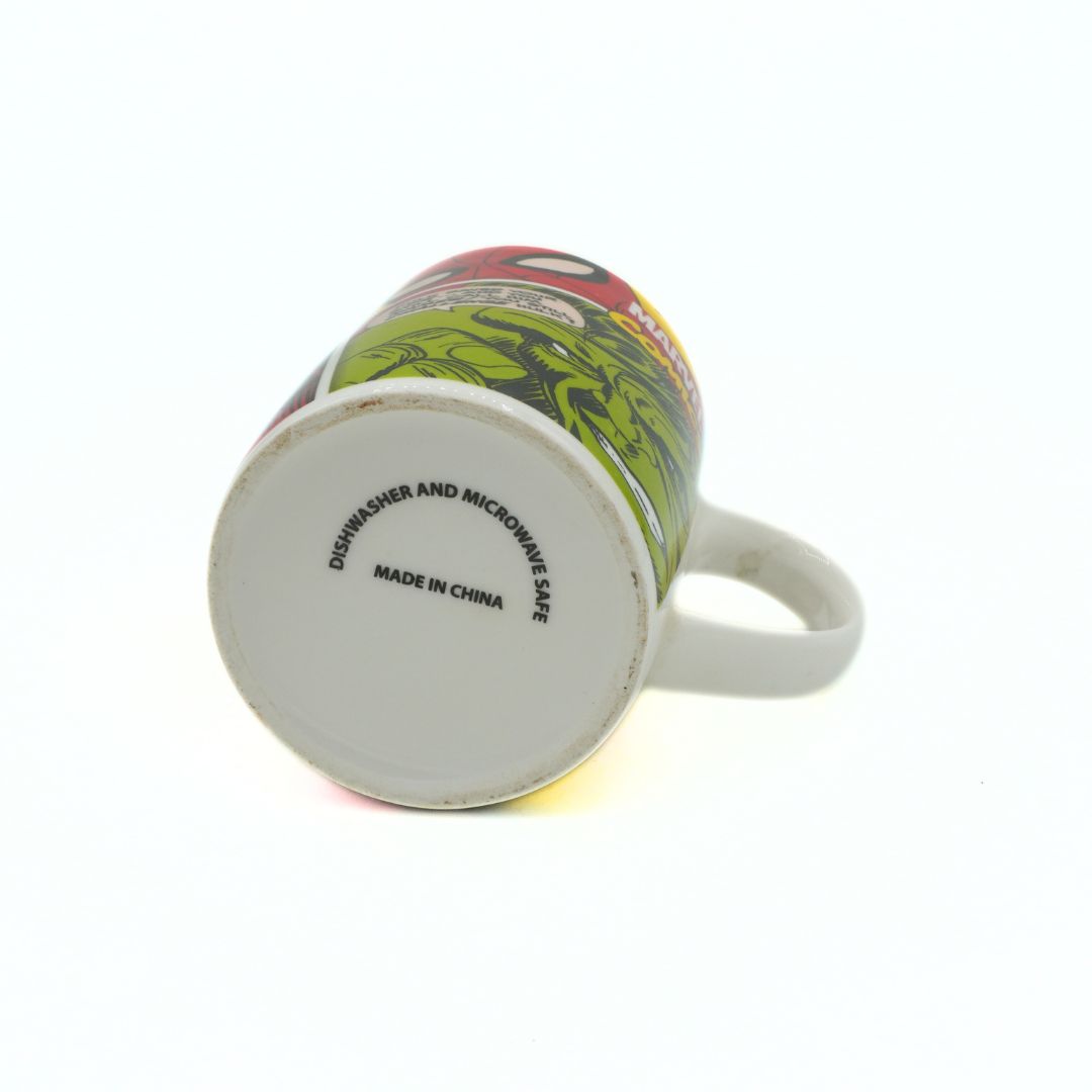 Mug with a colorful design on the side, showing 'Dishwasher and Microwave Safe' text.