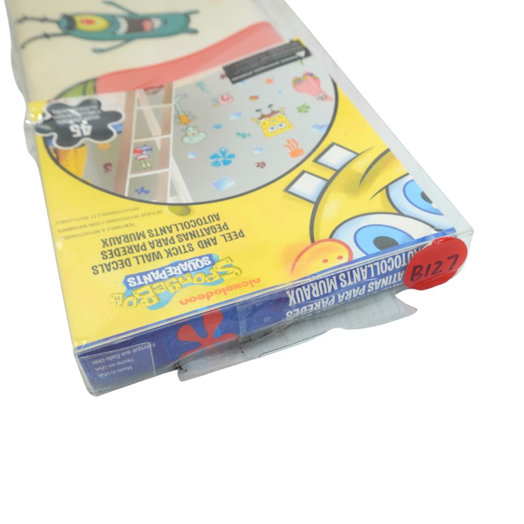 A packaged set of SpongeBob-themed wall decals in a clear plastic sleeve with a yellow printed insert card. The package shows the SpongeBob SquarePants logo and a red sticker that reads 'BIZ 7'.
