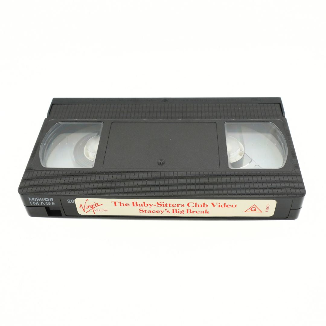 A black VHS video tape with a white label reading 'The Baby-Sitters Club Video: Stooey's Big Break' and a Virgin logo, photographed on a white background.