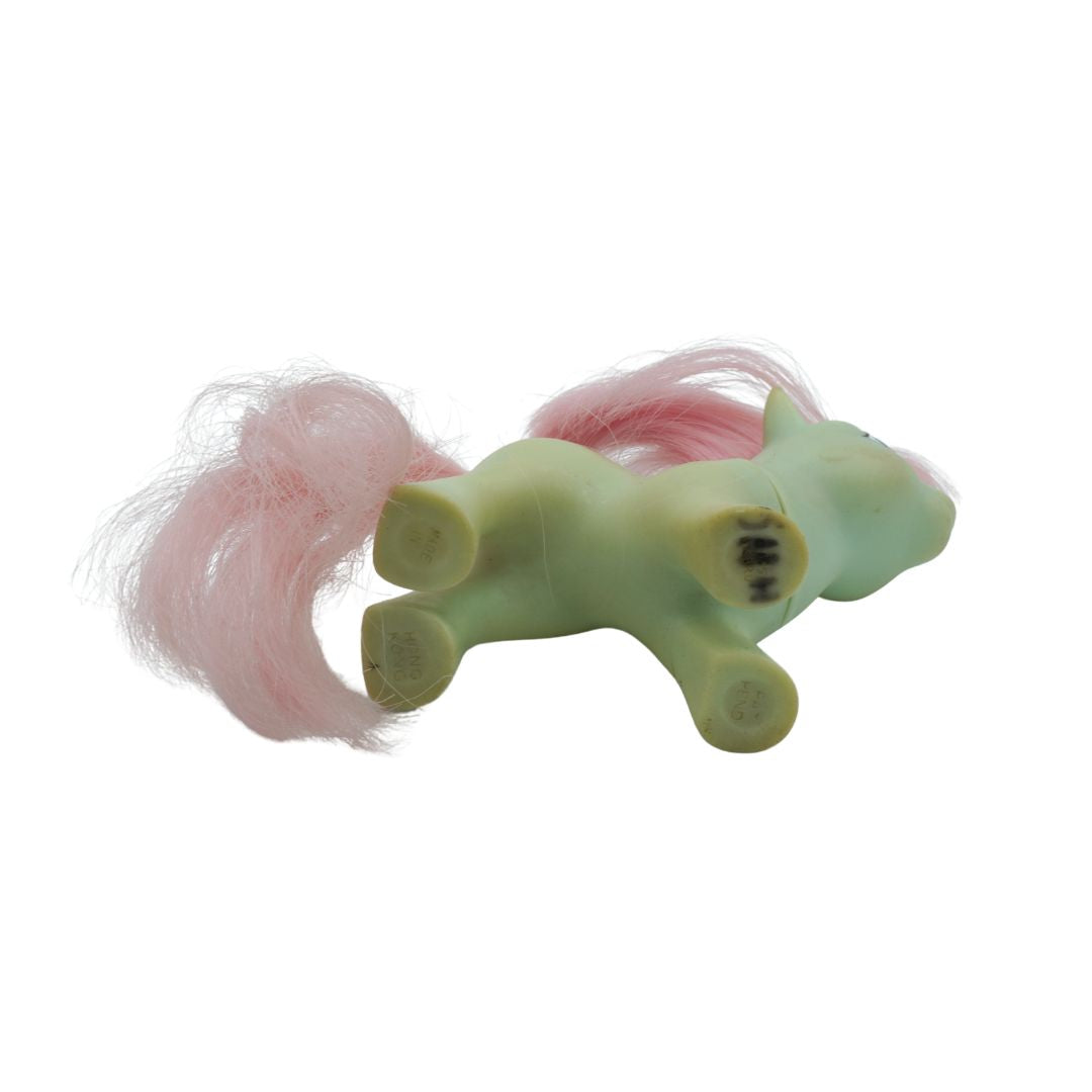 Underside of a vintage green and pink My Little Pony toy