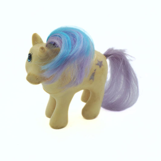 Toy horse with colorful mane and tail on a white background