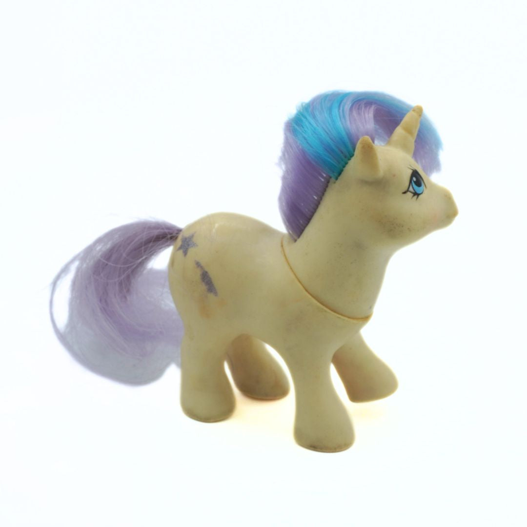 Toy unicorn with a blue and purple mane on a white background