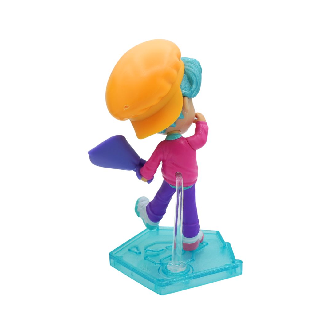 Blue haired Saja Boy Baby on a blue stand and holding pink roses, photographed against a white background.