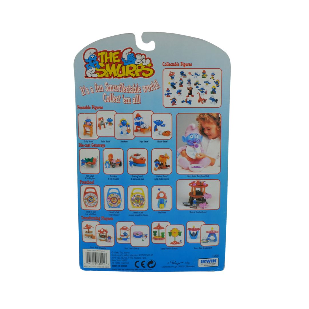 Packaged Smurf figures with branding and product information on a white background