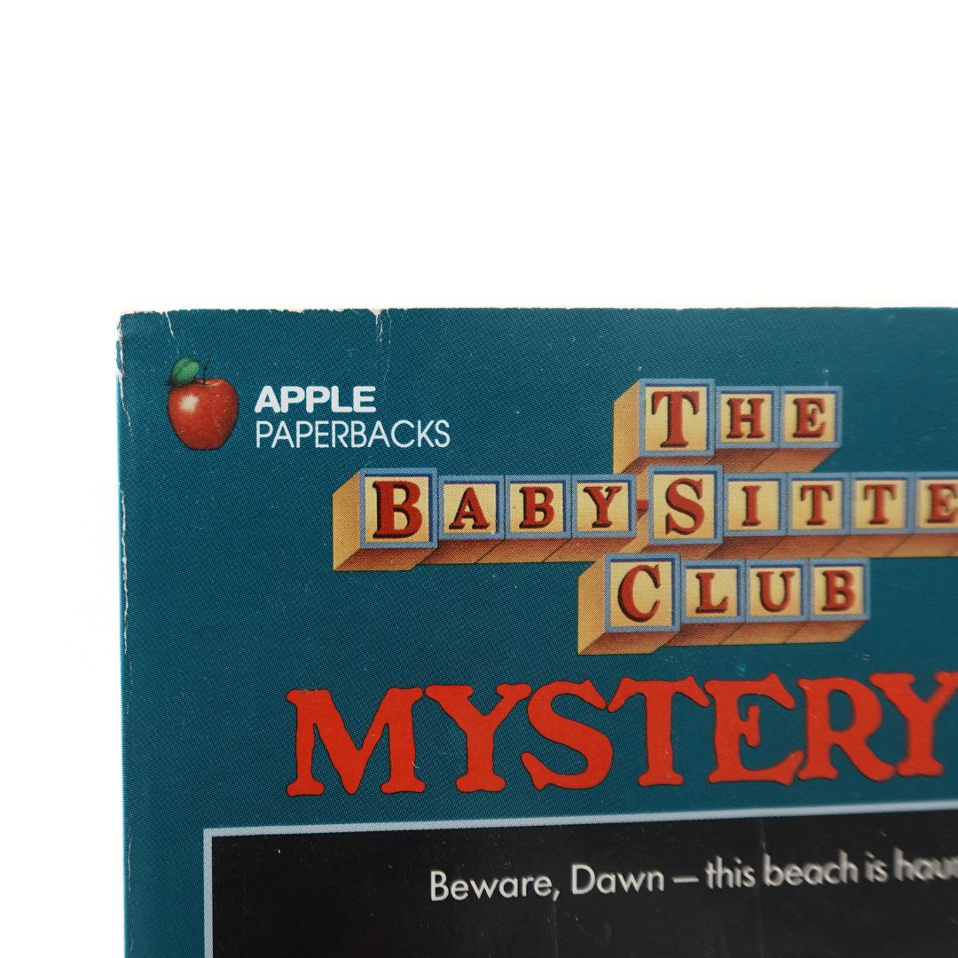 Close up of the front cover of The Babysitters Club Mystery #12 Dawn and the Surfer Ghost