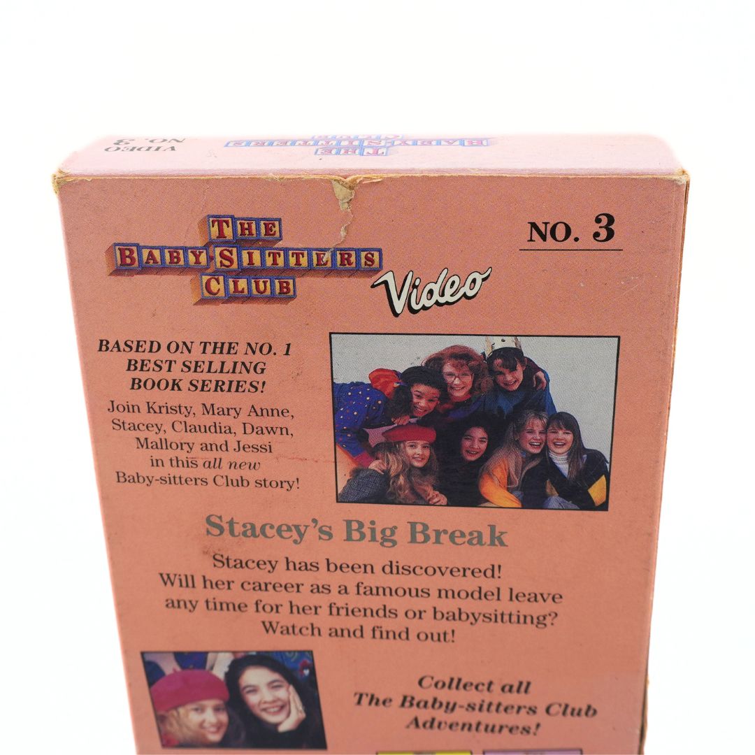 Vintage 'The Baby-Sitter Club' No. 3 video box set cover, featuring a dusty pink background with text and small photos of the cast.