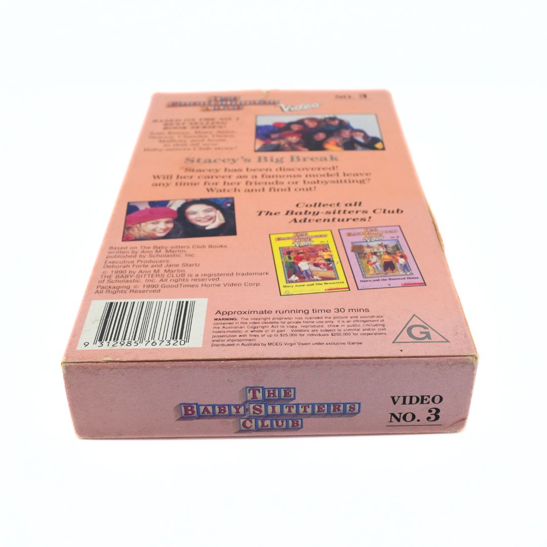 The back of a vintage VHS video case for 'The Baby Sitters Club Vol. 3', featuring a dusty pink cover with printed text, barcode, and colorful movie summaries.