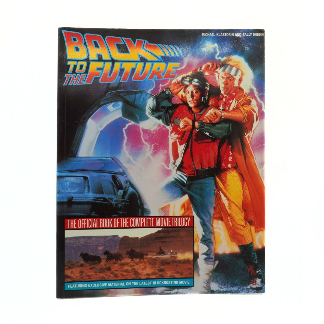 Book cover of 'Back to the Future' with characters and DeLorean car on a white background