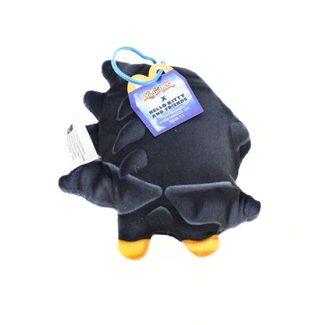 A black plush toy with orange feet and a blue hanging keychain loop, featuring a 'Hello Kitty and Friends' tag on a white background.