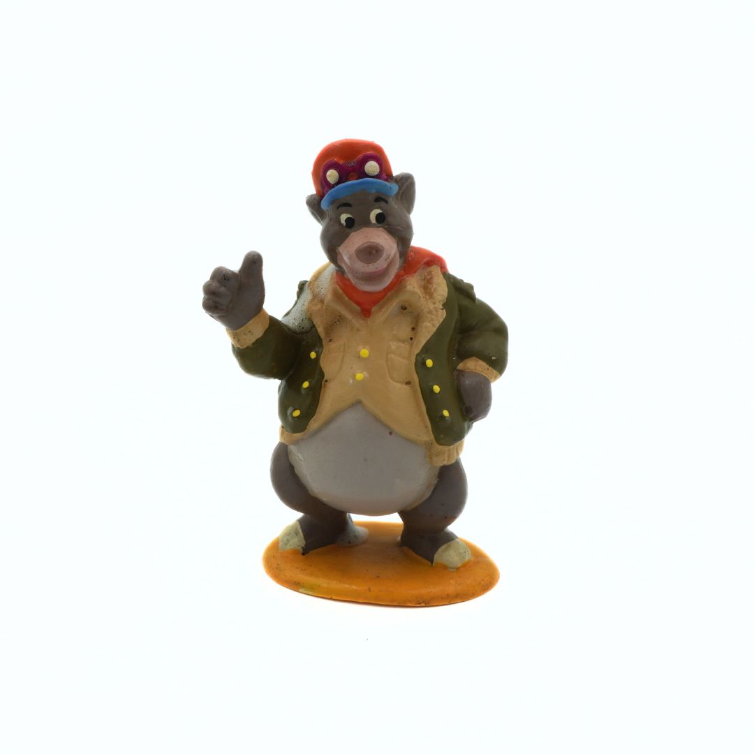 Animated character figurine with a jacket and hat on a white background