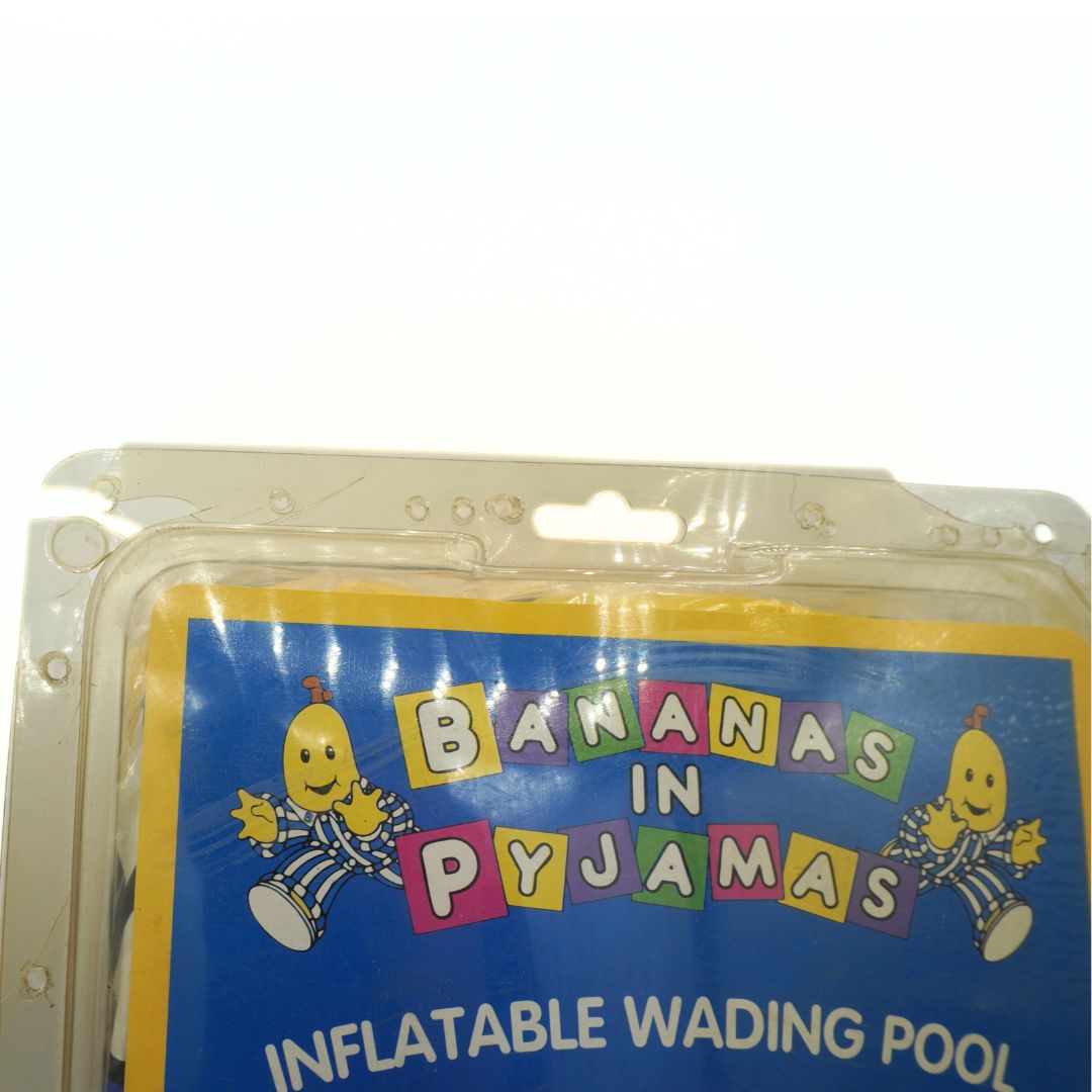 Packaged inflatable wading pool with 'Bananas in Pyjamas' branding on a white background