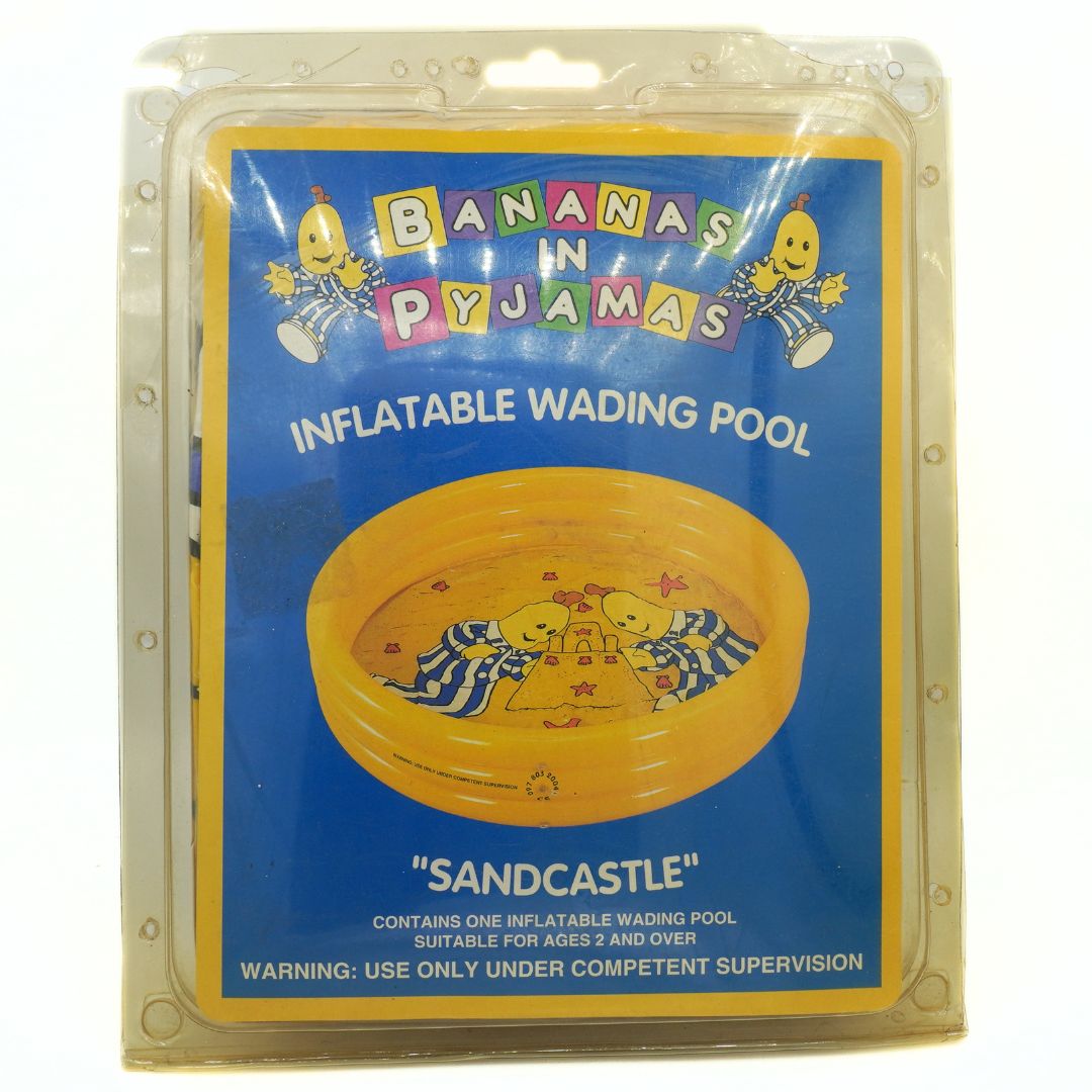 Packaged inflatable wading pool with 'Bananas in Pyjamas' branding on a blue background.
