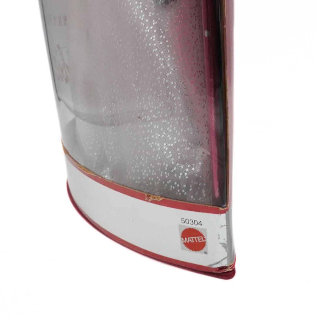 Close-up of a toy packaging corner with a Mattel logo on a white background