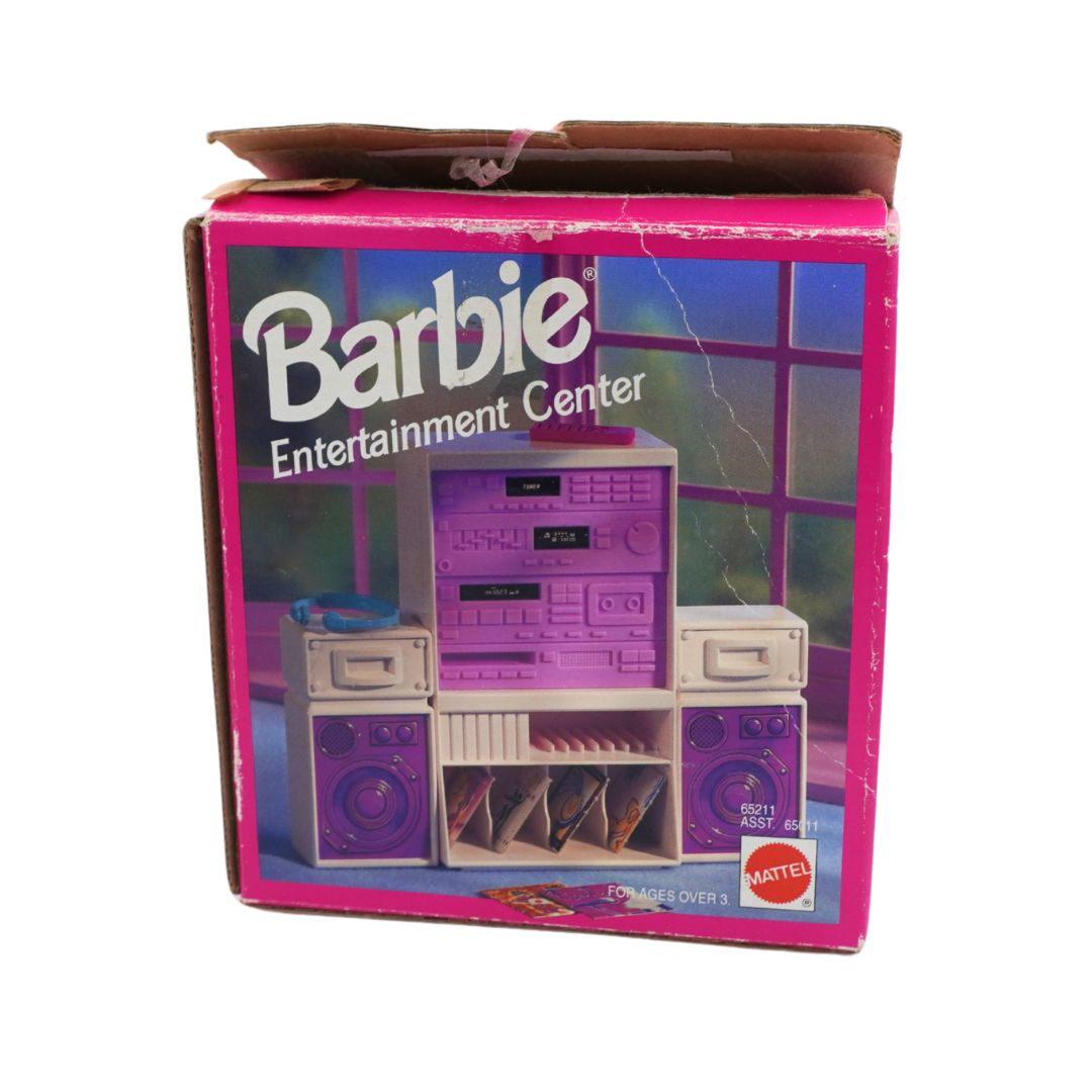 Vintage Mattel Barbie Entertainment Center toy set in its original pink and purple cardboard box, featuring a retro boombox and speakers.