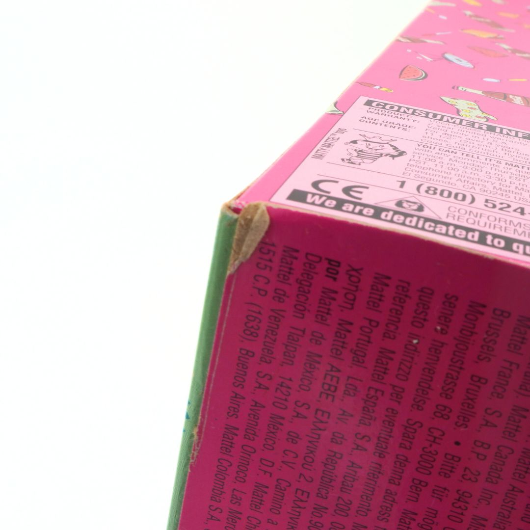 Close-up of a product packaging with text and a phone number on a white background
