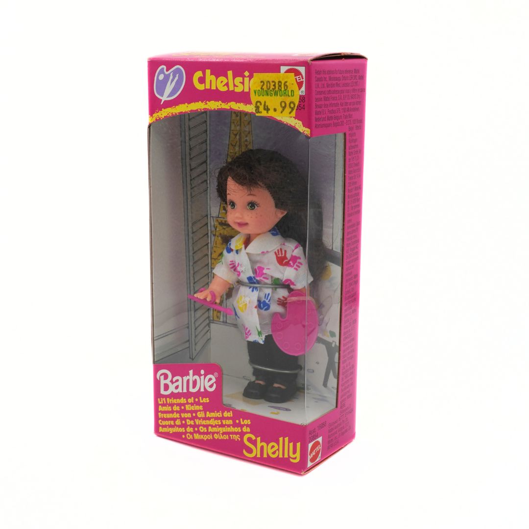 Barbie Chelsea doll packaging with pink and purple box on a white background
