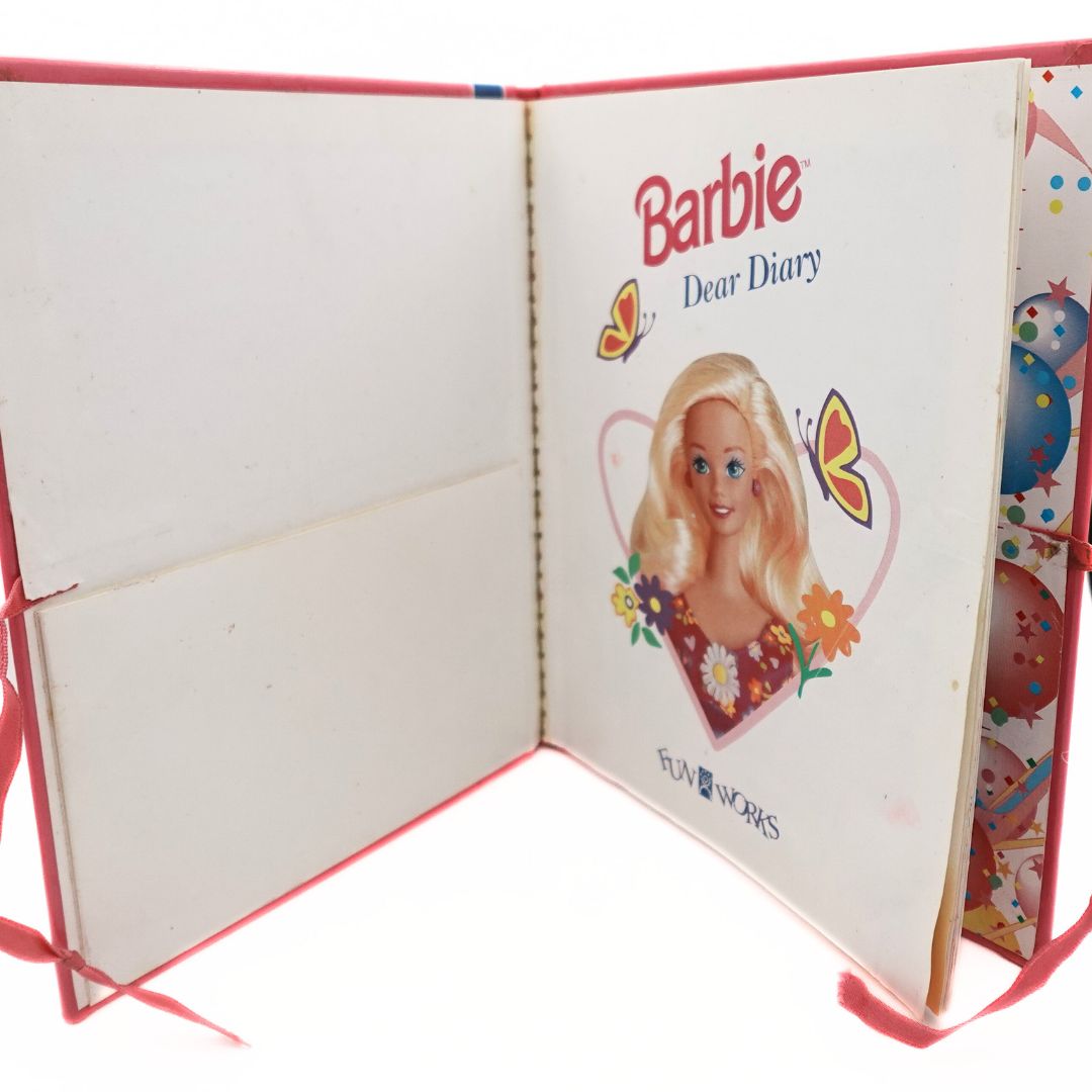 Internal cover of the pink 1996 Barbie Dear Diary book, showing some minor damage