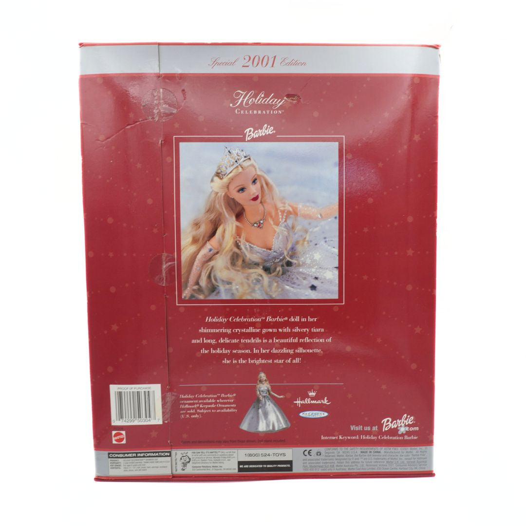 Barbie Holiday Celebration doll packaging with a red background