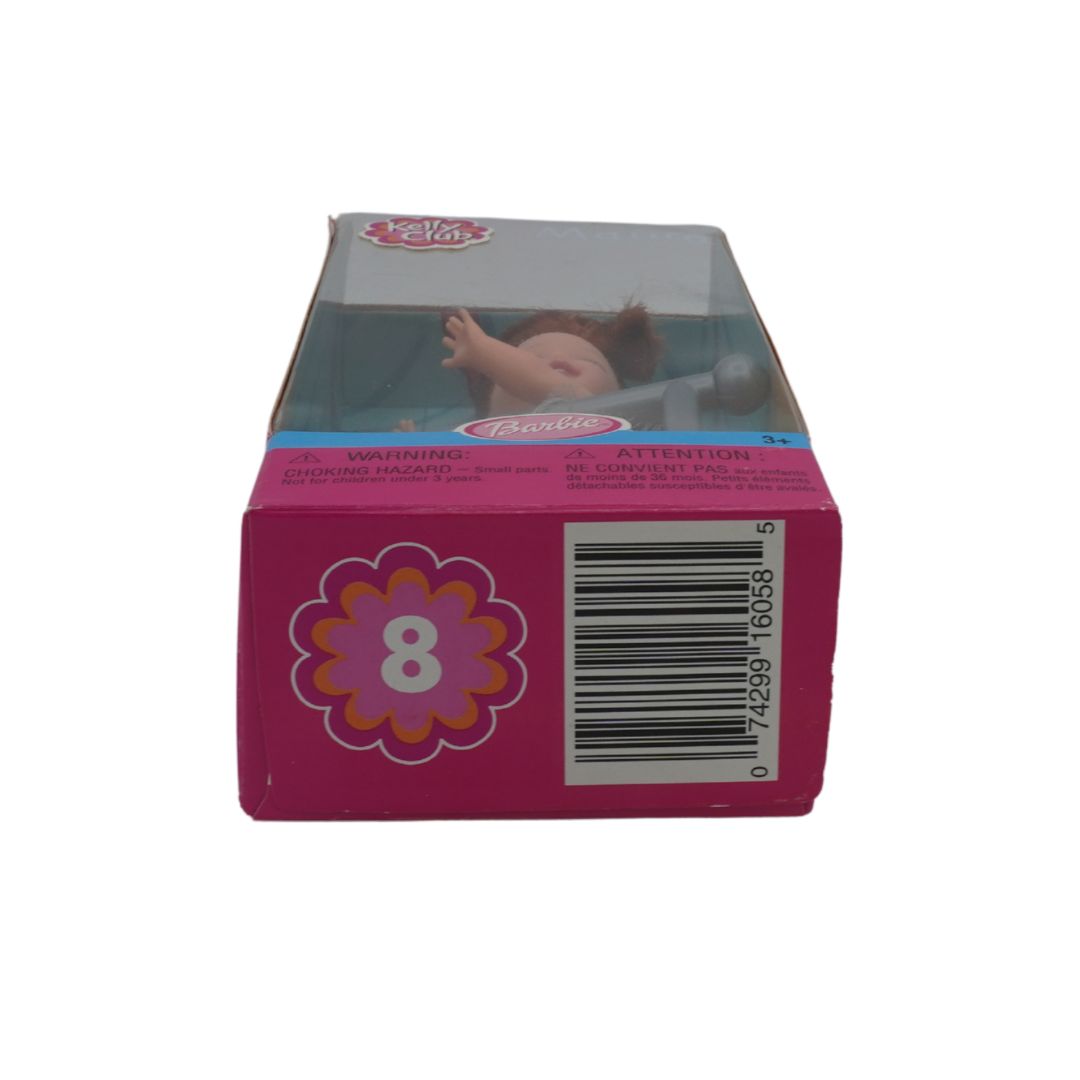 Pink toy packaging with a barcode and floral design on a white background