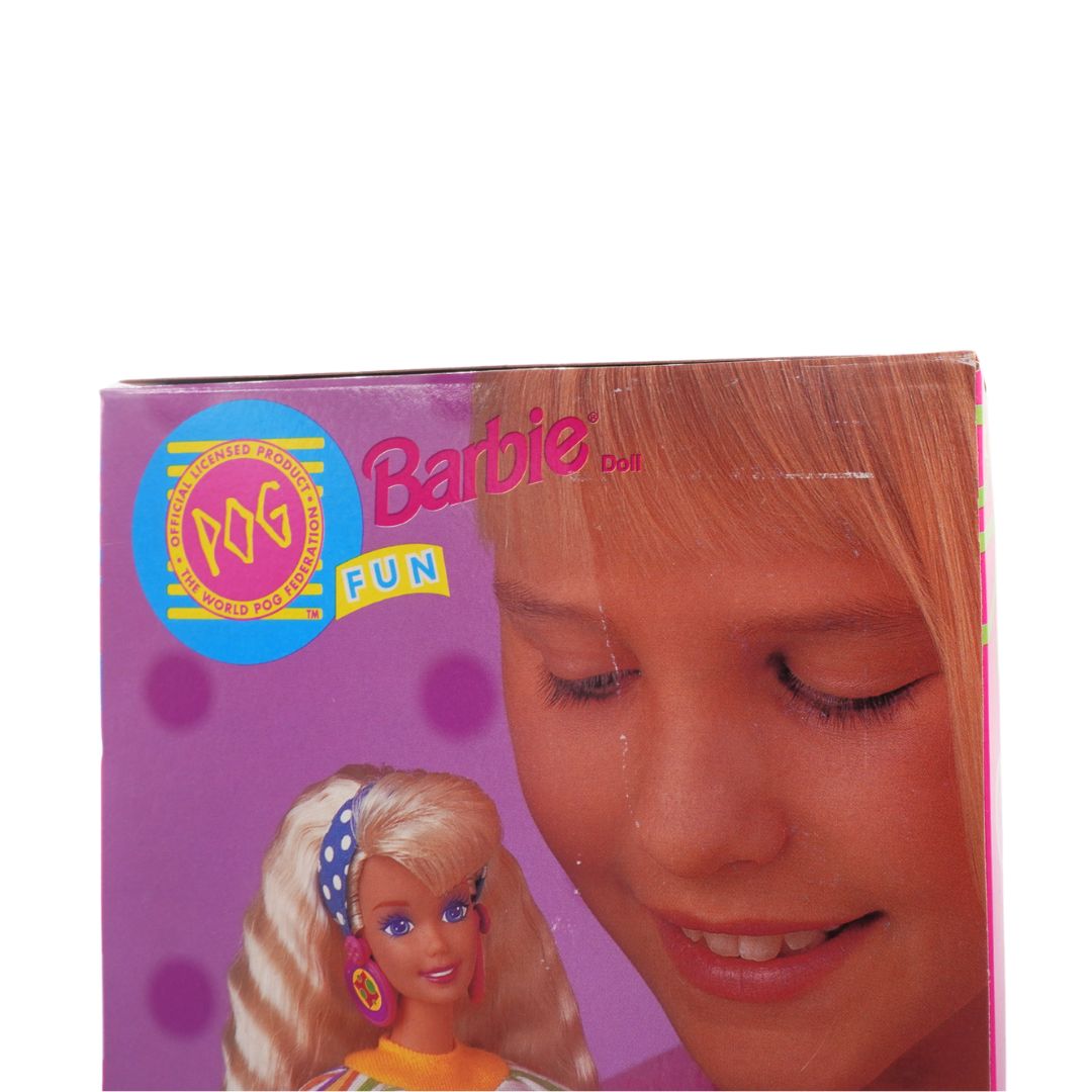 Barbie doll packaging with a close-up of a girl's face on a white background