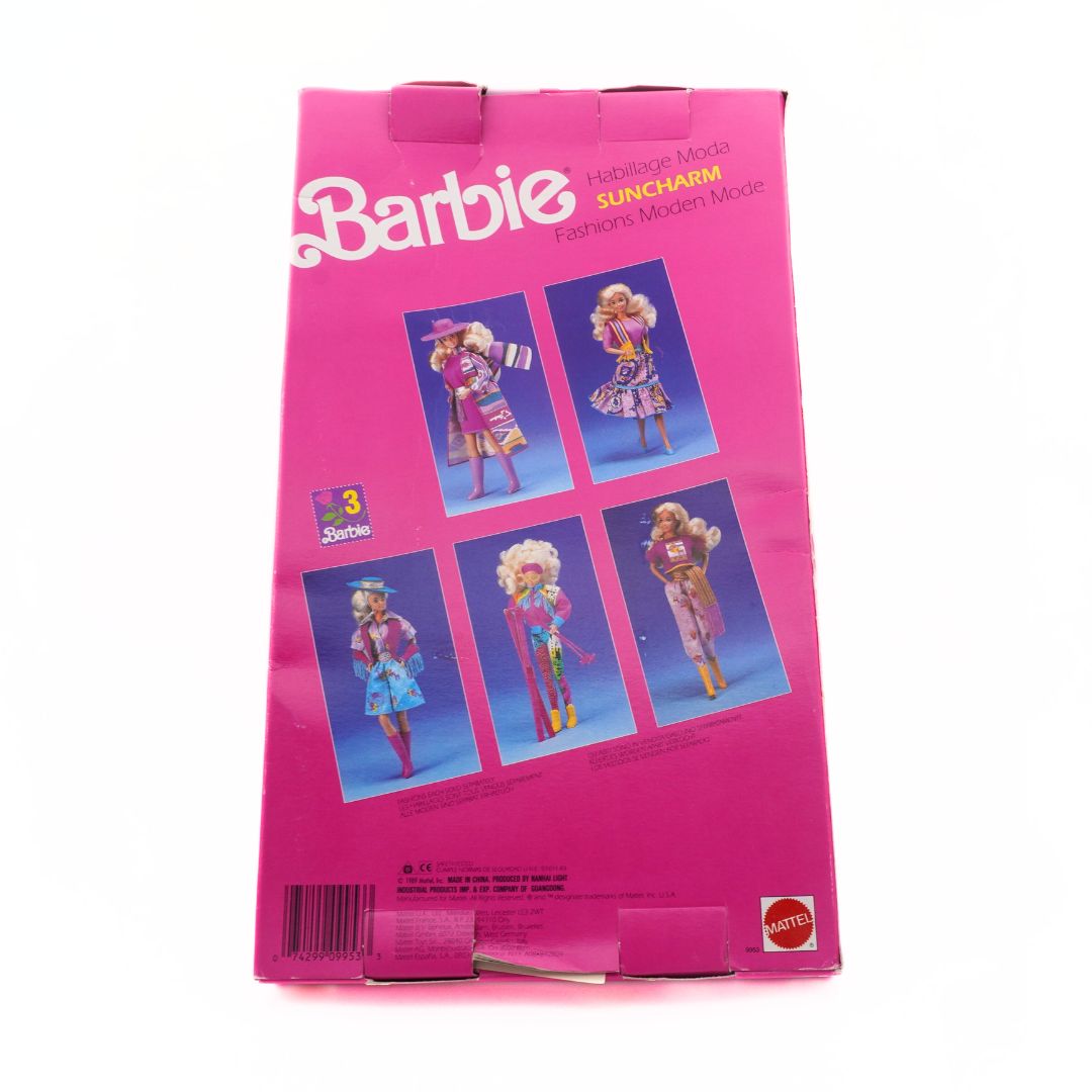 Barbie Suncharm doll packaging with images of the doll on a pink background