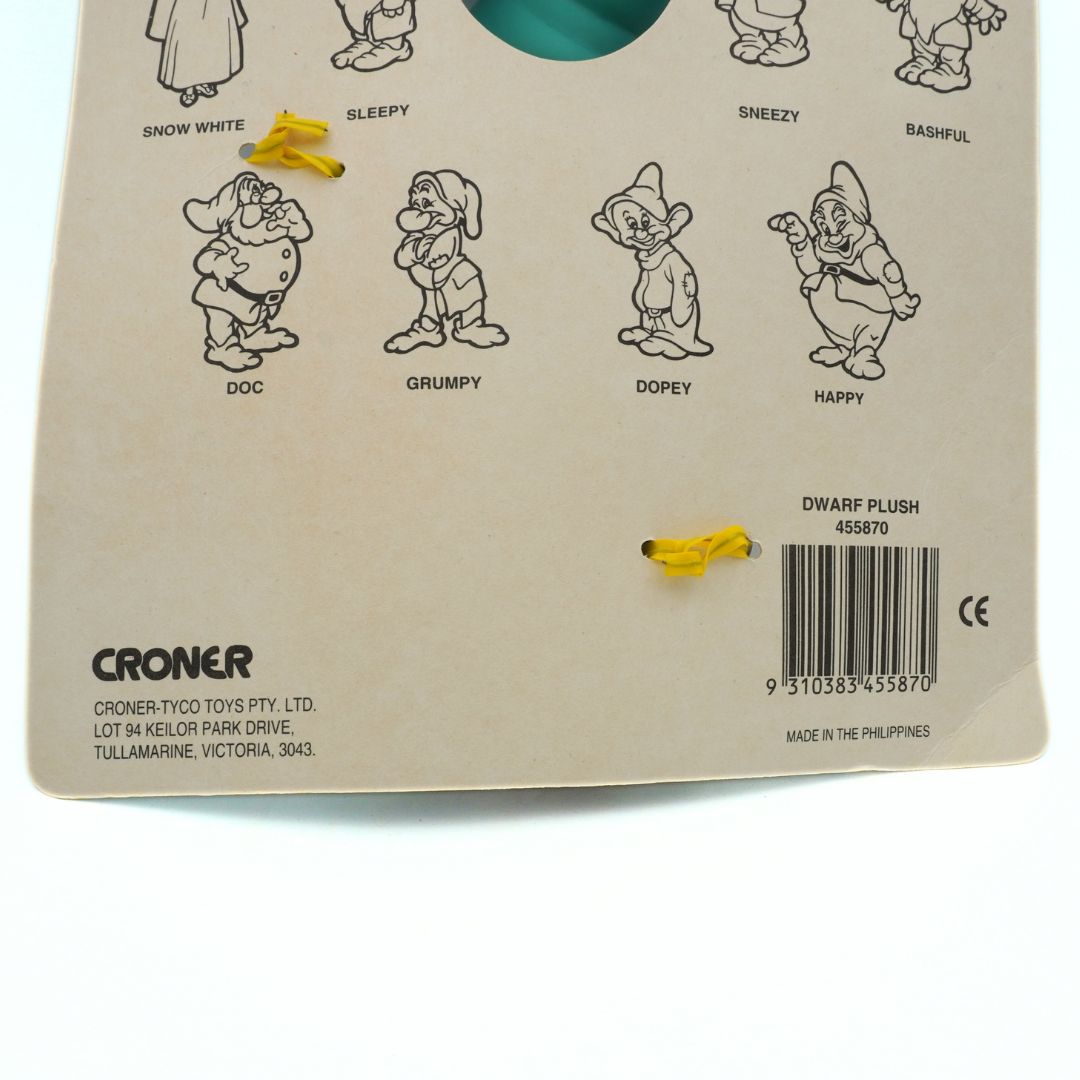 Back of a toy packaging with illustrations of dwarves and product details.