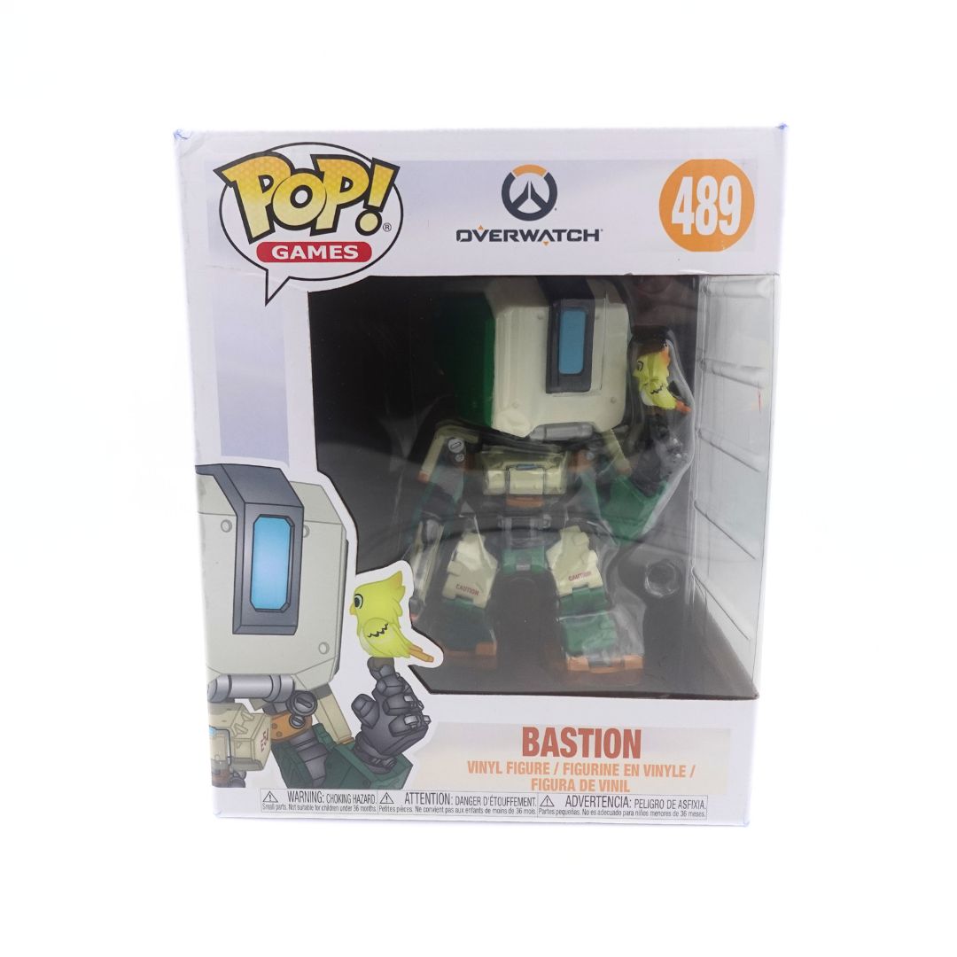 Photo of the large sized Bastion Funko Pop with a bird on his hand. He is seen inside his original packaging numbered 489