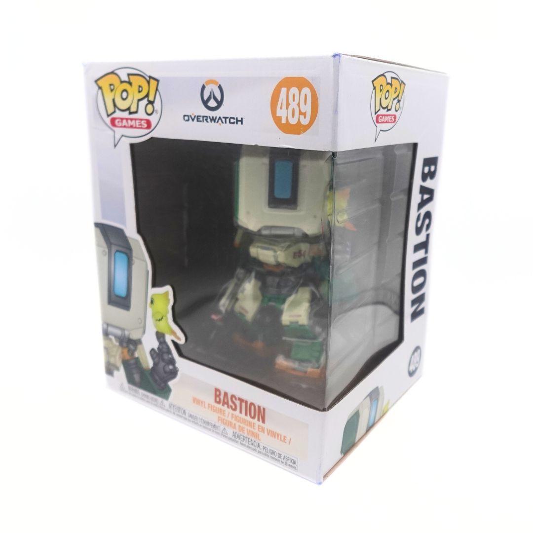 Photo of the large sized Bastion Funko Pop with a bird on his hand. He is seen inside his original packaging numbered 489