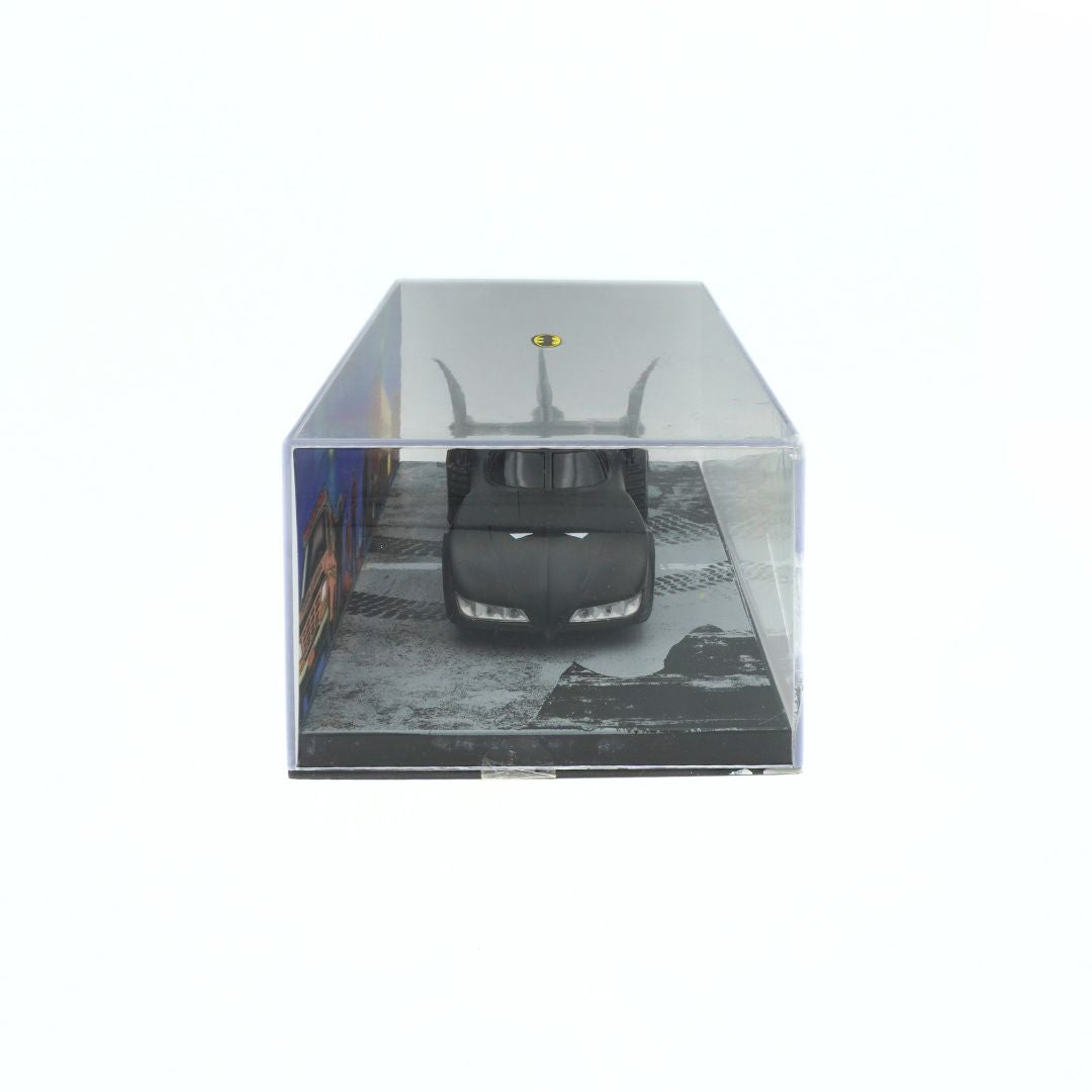 Clear plastic display case with a black car model inside on a white background