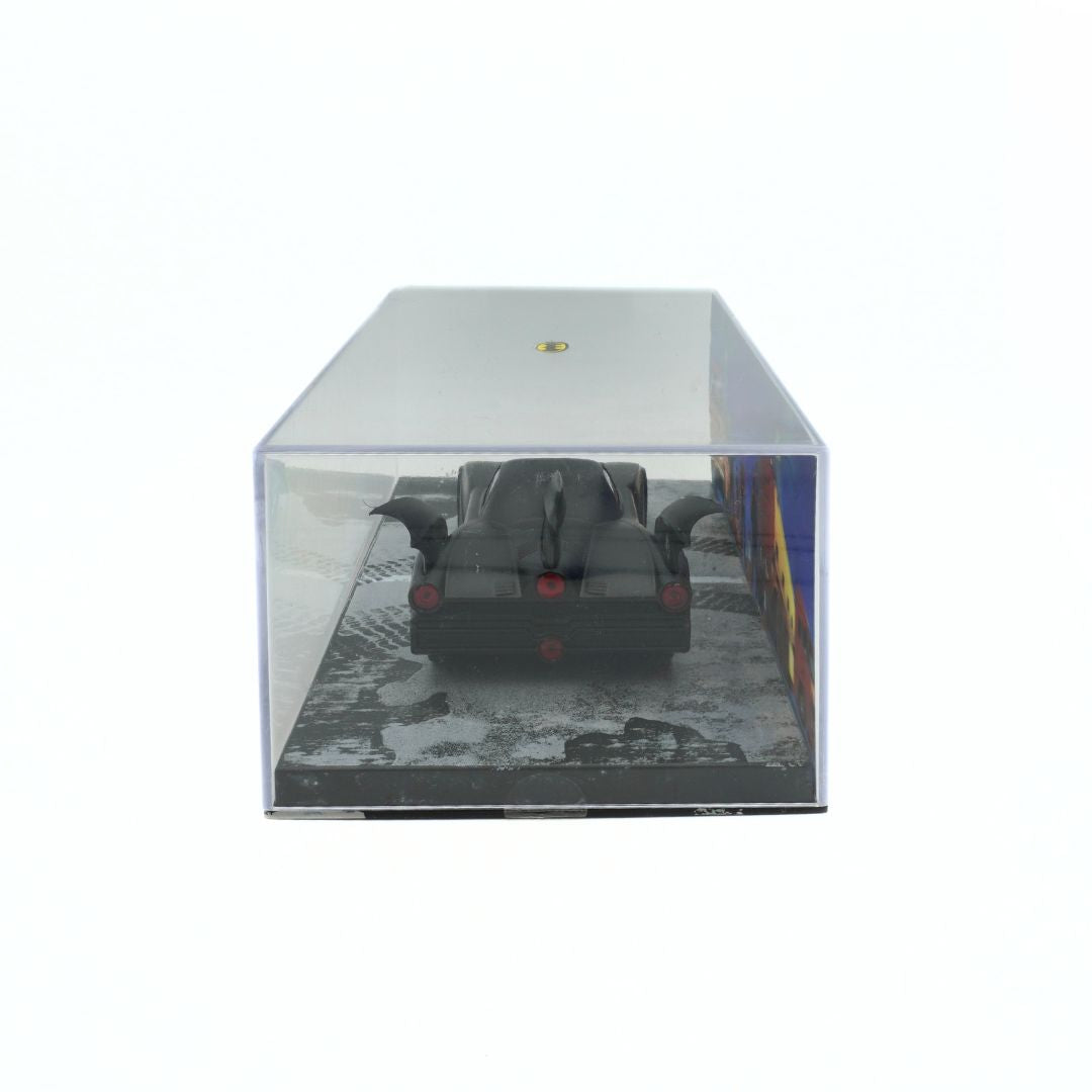 Model car inside a clear display case on a white background
