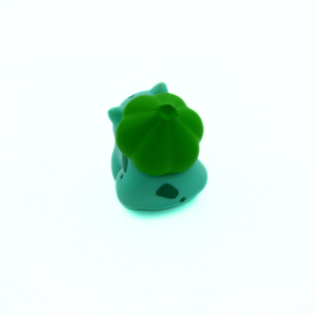 Green and blue rubber duck on a white background