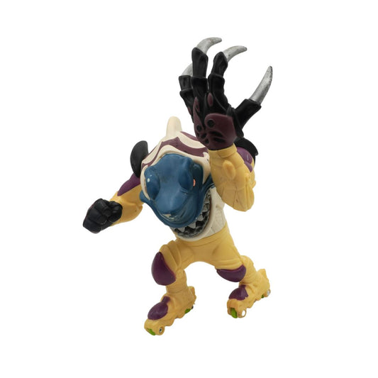 Toy figure of a creature with blue face, yellow body, and black claws on a white background