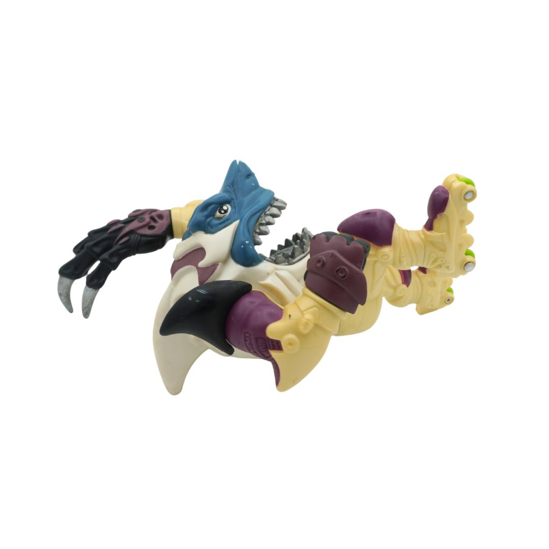 Toy figure of a creature with blue, purple, and beige colors on a white background