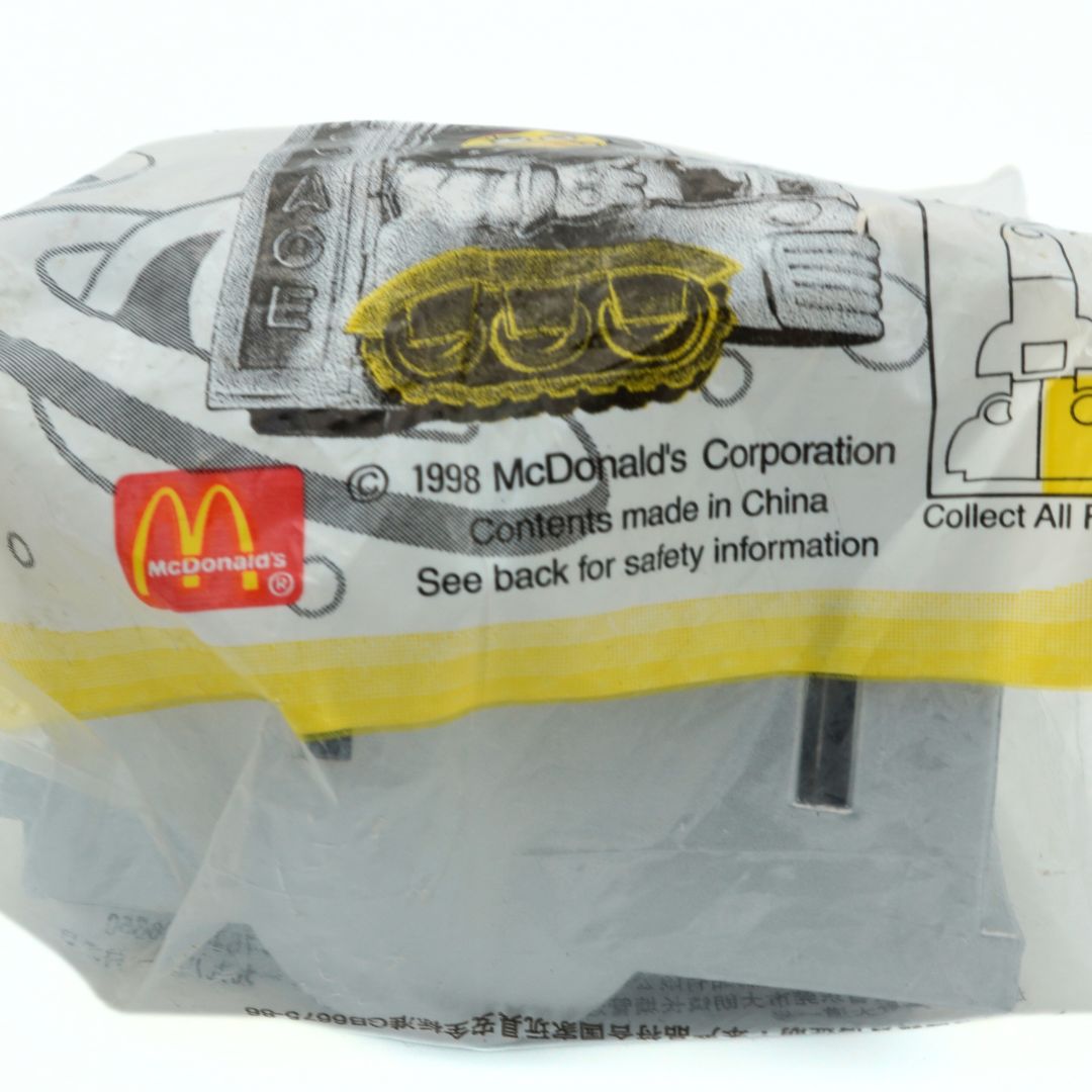 Copyright details and information on the base of a 90s McSpace Happy Meal toy