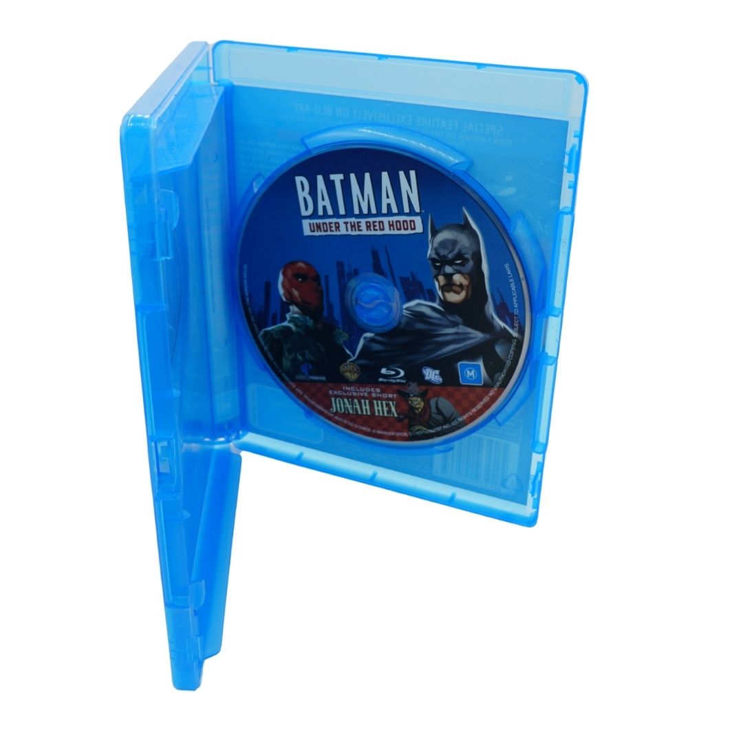 Batman Under the Red Hood Blu-ray disc in a translucent blue plastic case, shown open against a plain white background.