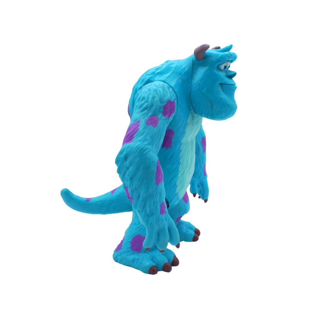 Blue monster toy with purple spots on a white background