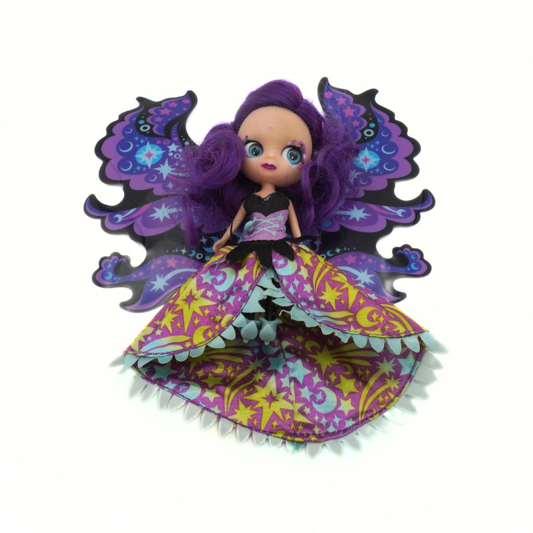 Colorful fairy doll with purple hair and wings on a white background