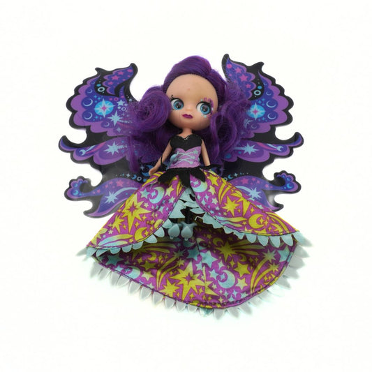 Colorful fairy doll with purple hair and wings on a white background