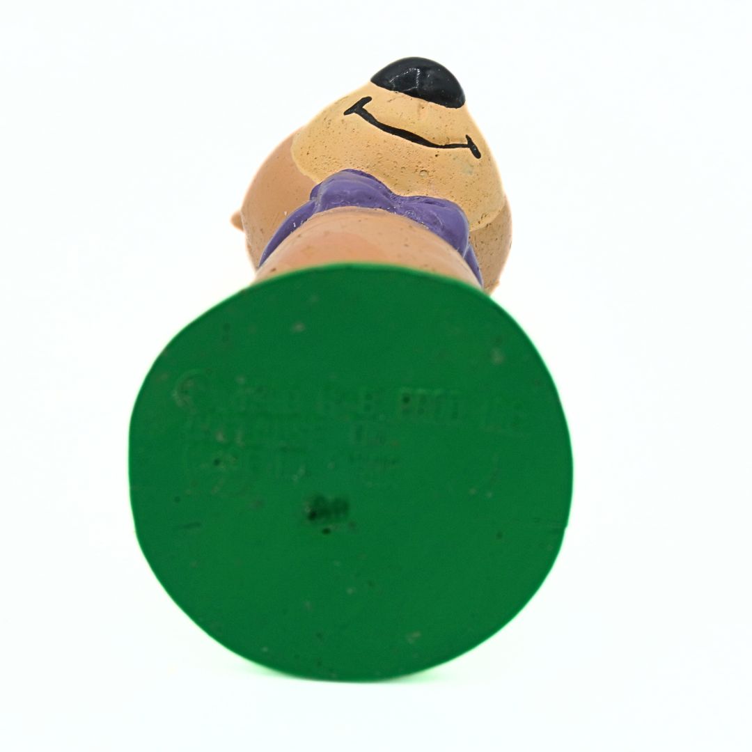 Green stand with a bear character on a white background