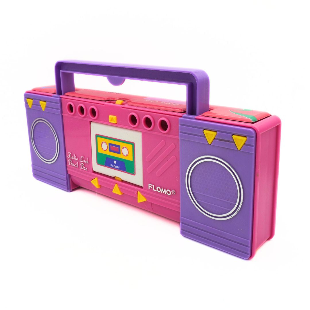 Pink and purple toy boombox with a cassette tape design on a white background