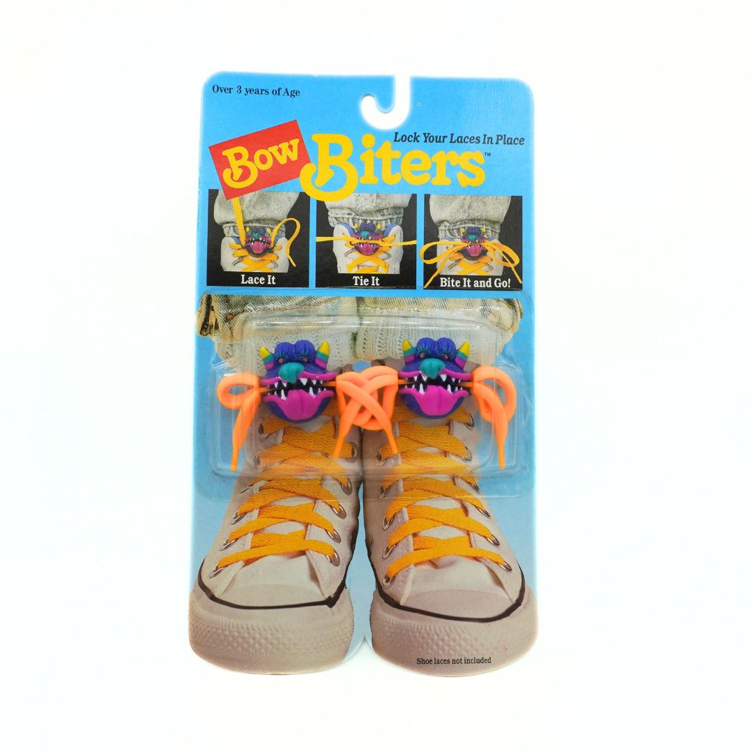 Bow Biters shoe lace holders packaging with orange laces on a white background