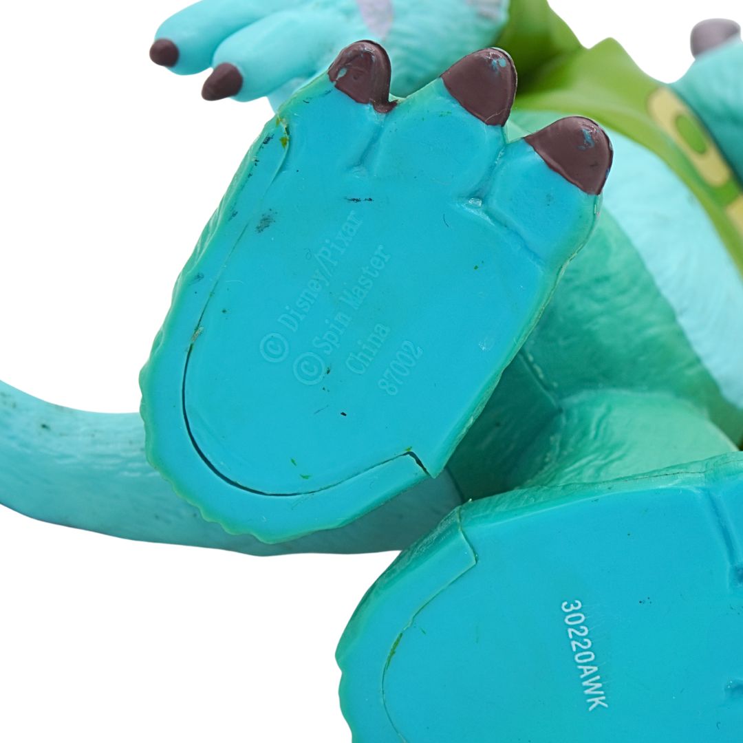 Close-up of a teal toy with brown accents on a white background