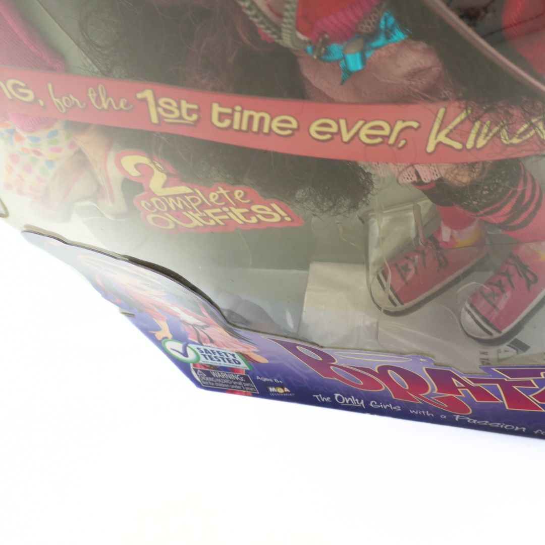 Box of a product with text '1st time ever, Kina' and '2 complete outfits!' on a white background.
