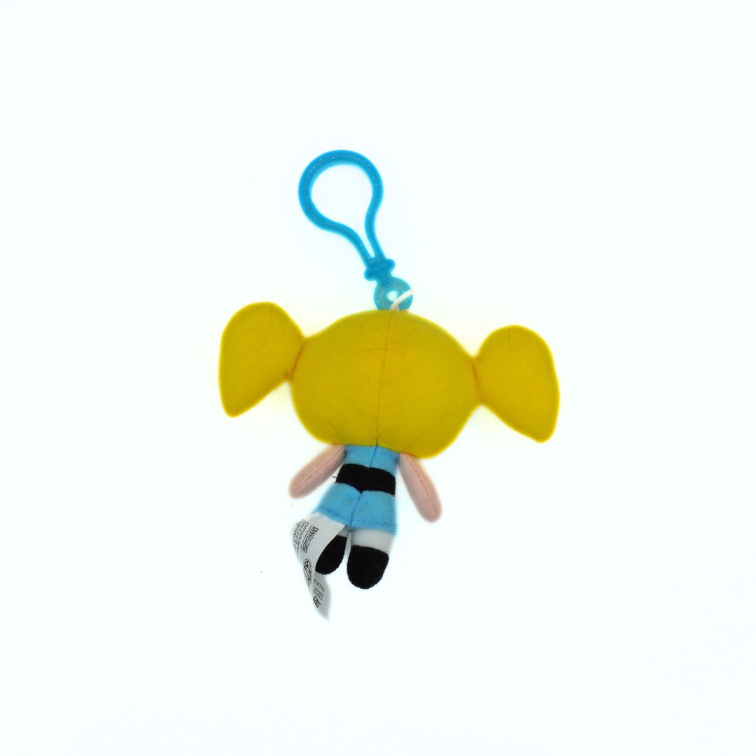 Plush keychain with a character in a blue outfit on a white background