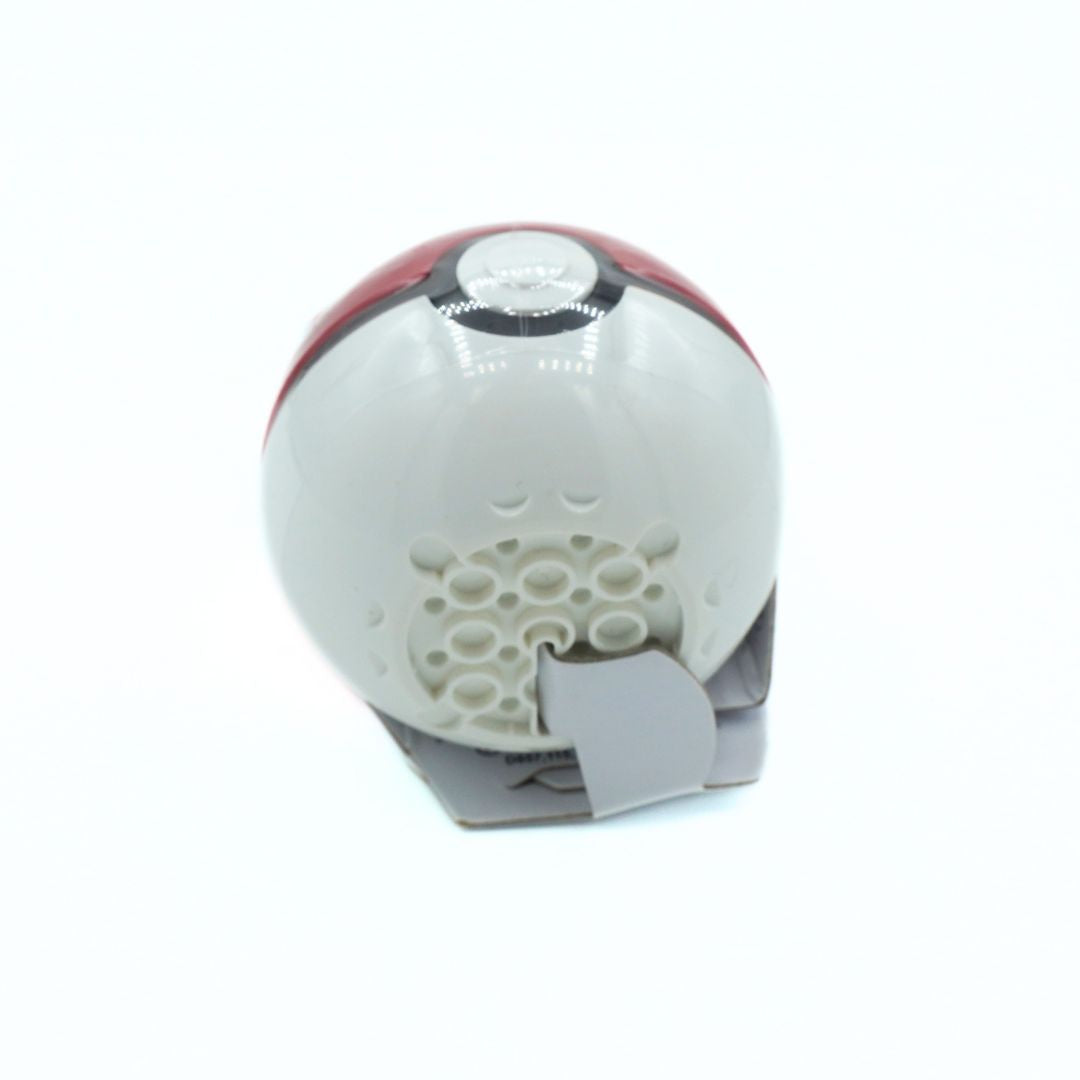 A miniature replica of a Pokéball toy, featuring its classic red and white color scheme with a gray base and speaker grille, set against a plain white background.