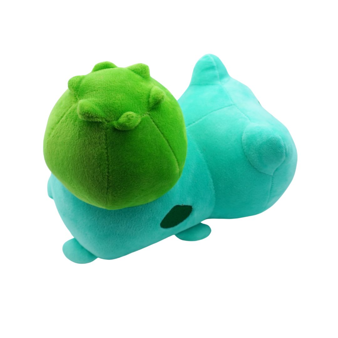 Plush toy with green head and blue body on a white background